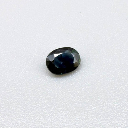 0.43 ct natural teal Laos sapphire with oval faceted cut and rich teal colour