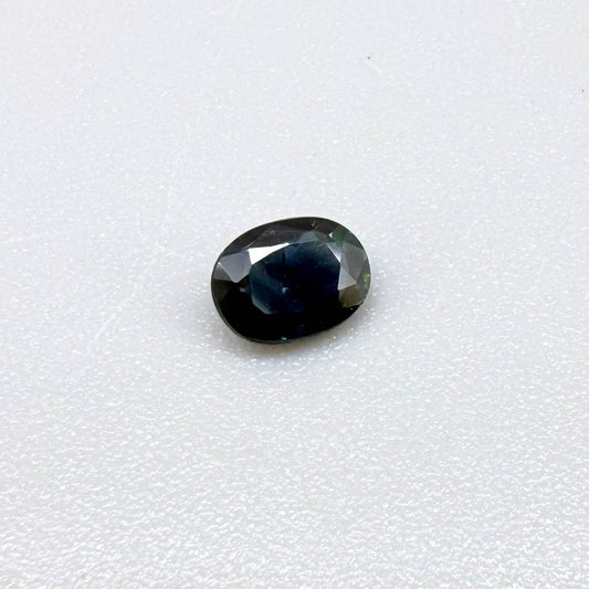 0.43 ct natural teal Laos sapphire with oval faceted cut and rich teal colour