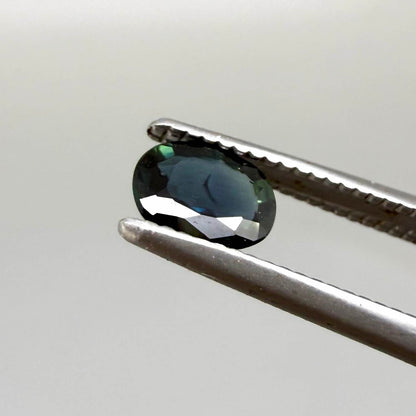 0.43 ct natural teal Laos sapphire with oval faceted cut and rich teal colour
