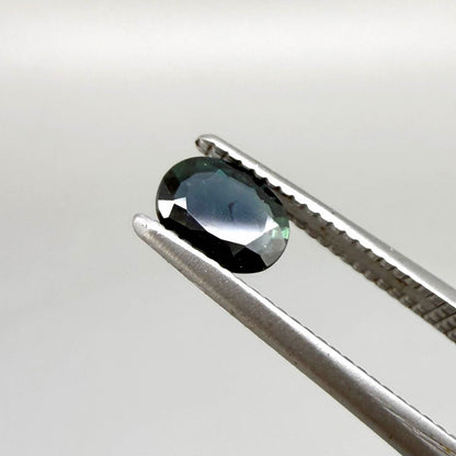 0.43 ct natural teal Laos sapphire with oval faceted cut and rich teal colour
