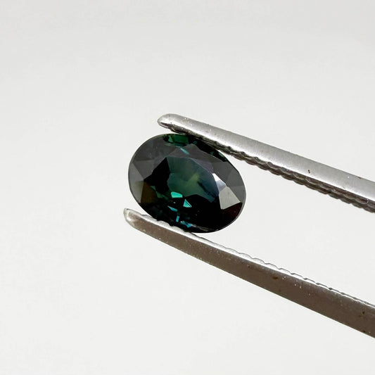 0.51 ct natural teal Laos sapphire with oval faceted cut and rich teal colour