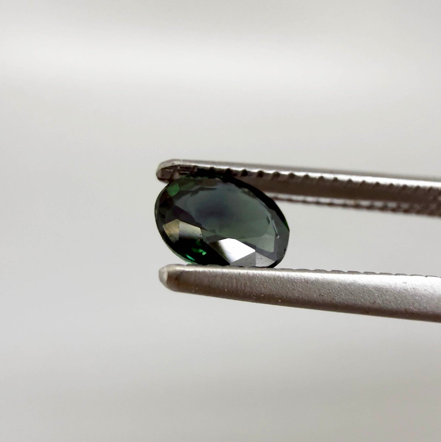 0.30 ct natural green Laos sapphire with oval faceted cut and rich green colour