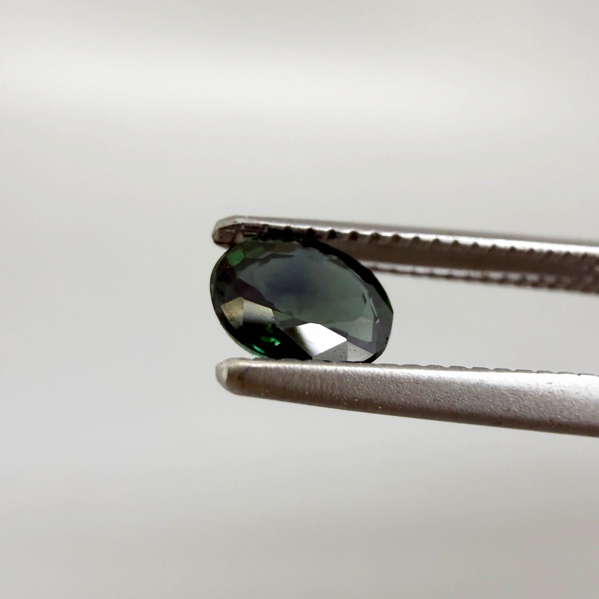 0.30 ct natural green Laos sapphire with oval faceted cut and rich green colour