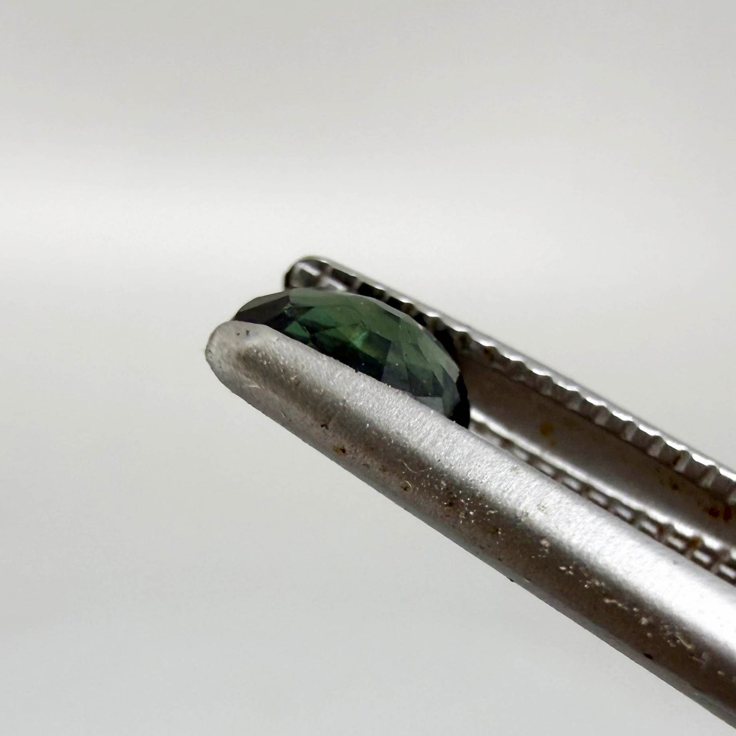 0.30 ct natural green Laos sapphire with oval faceted cut and rich green colour
