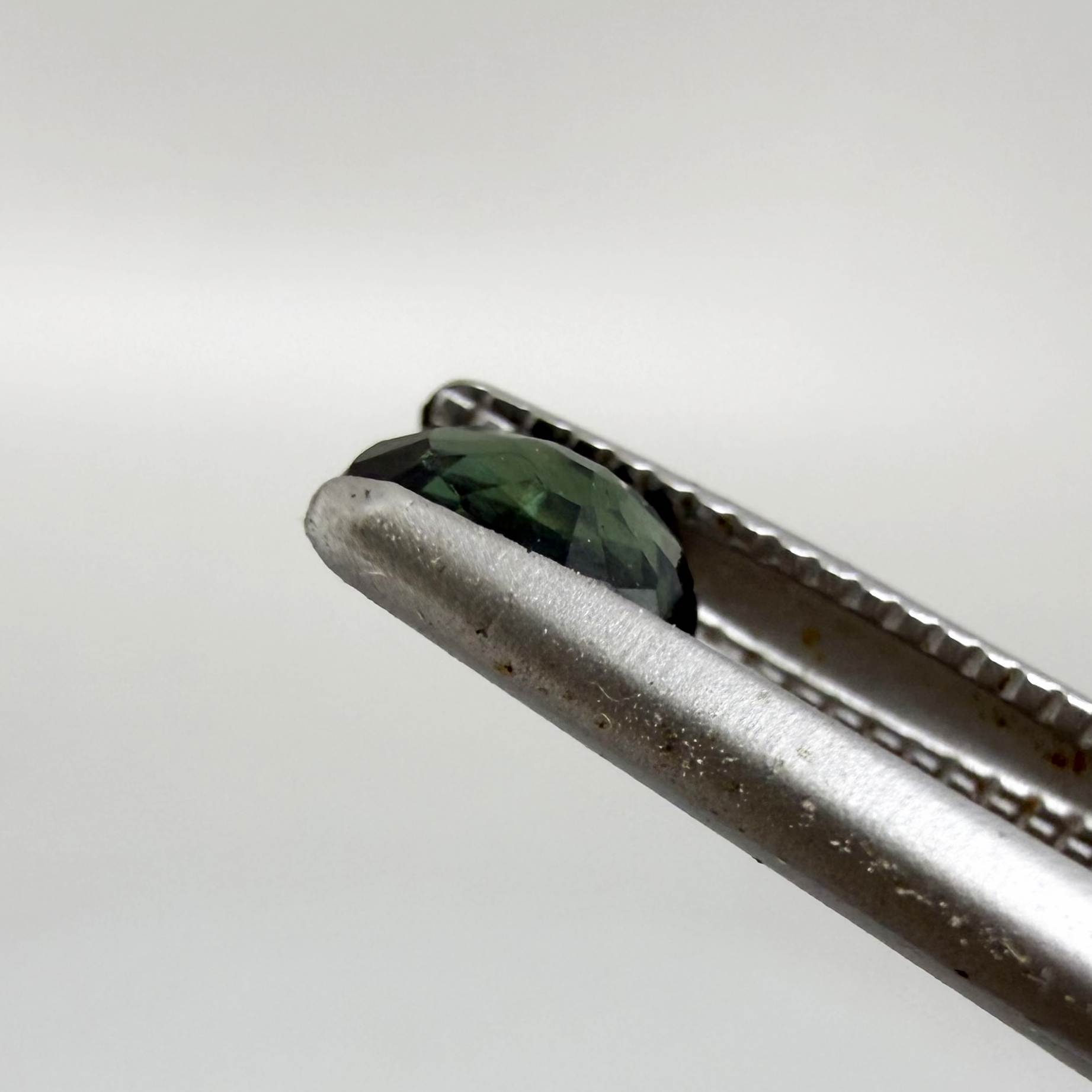 0.30 ct natural green Laos sapphire with oval faceted cut and rich green colour