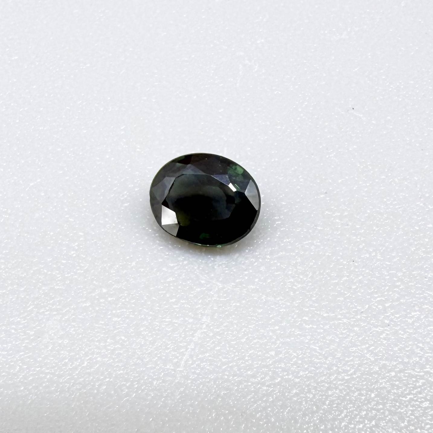 0.30 ct natural green Laos sapphire with oval faceted cut and rich green colour