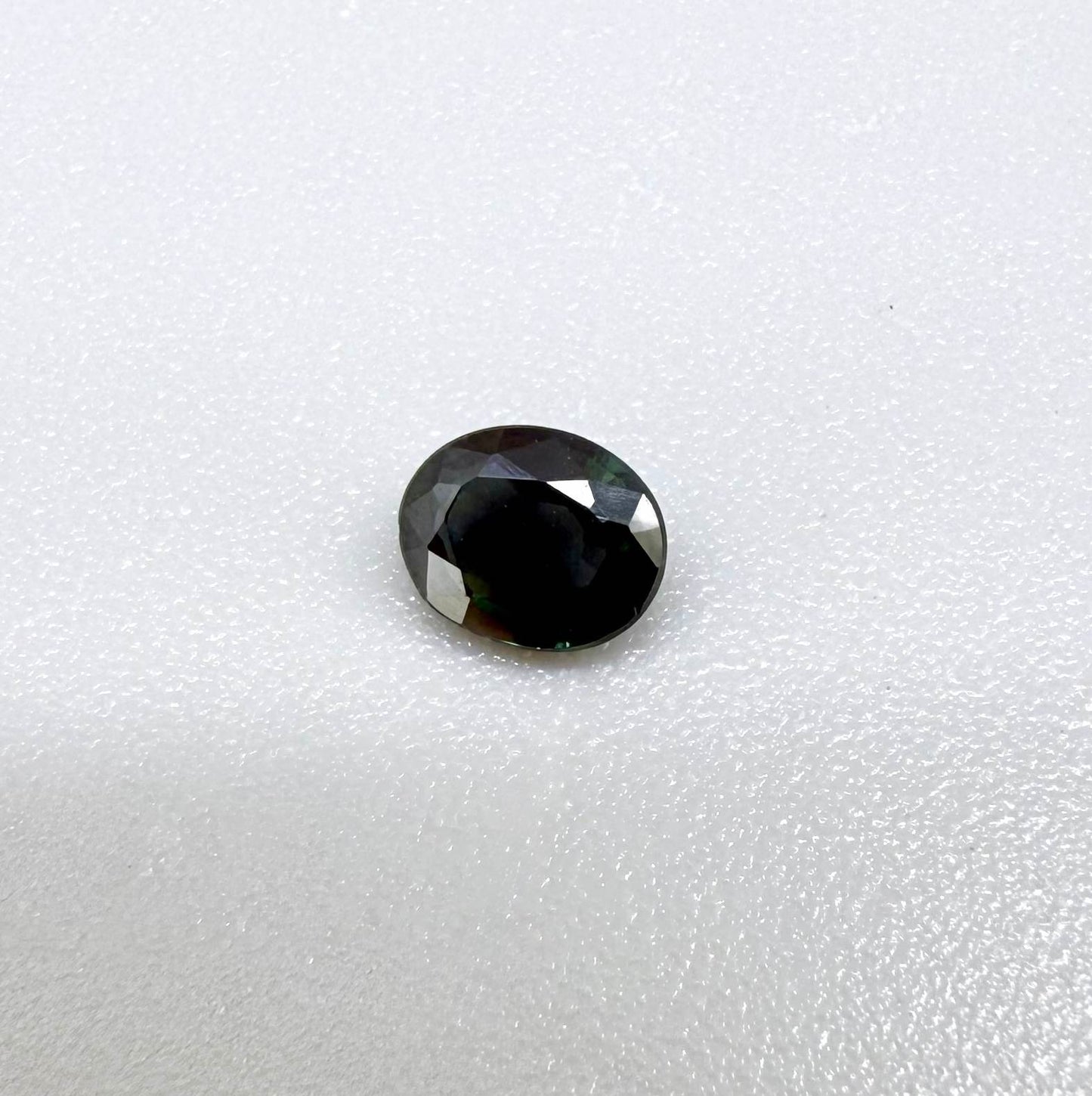 0.30 ct natural green Laos sapphire with oval faceted cut and rich green colour