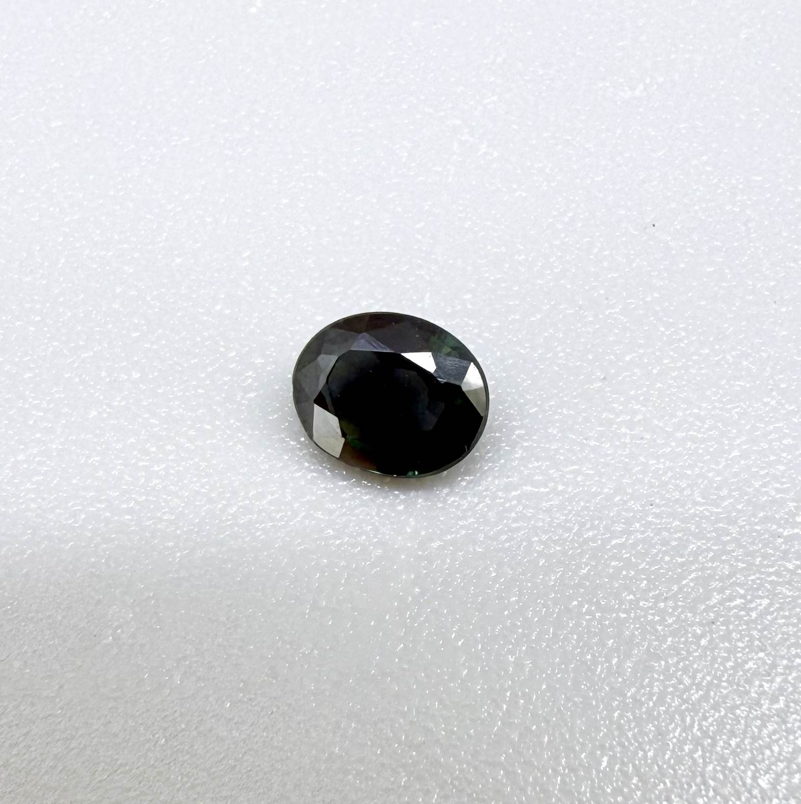 0.30 ct natural green Laos sapphire with oval faceted cut and rich green colour
