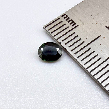 0.30 ct natural green Laos sapphire with oval faceted cut and rich green colour