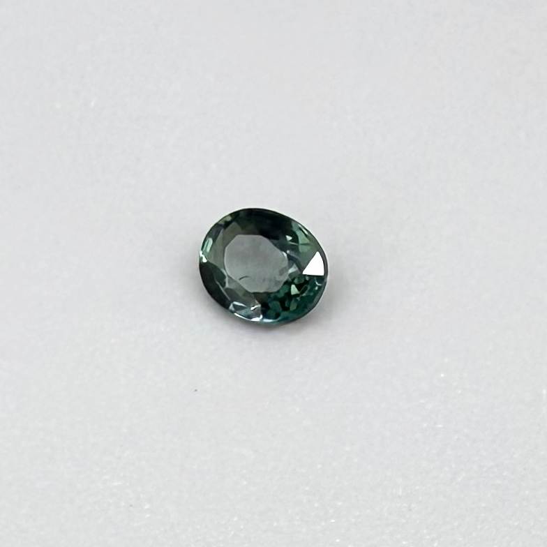 0.30 ct natural teal Laos sapphire with oval faceted cut and vibrant teal colour