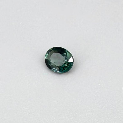 0.30 ct natural teal Laos sapphire with oval faceted cut and vibrant teal colour