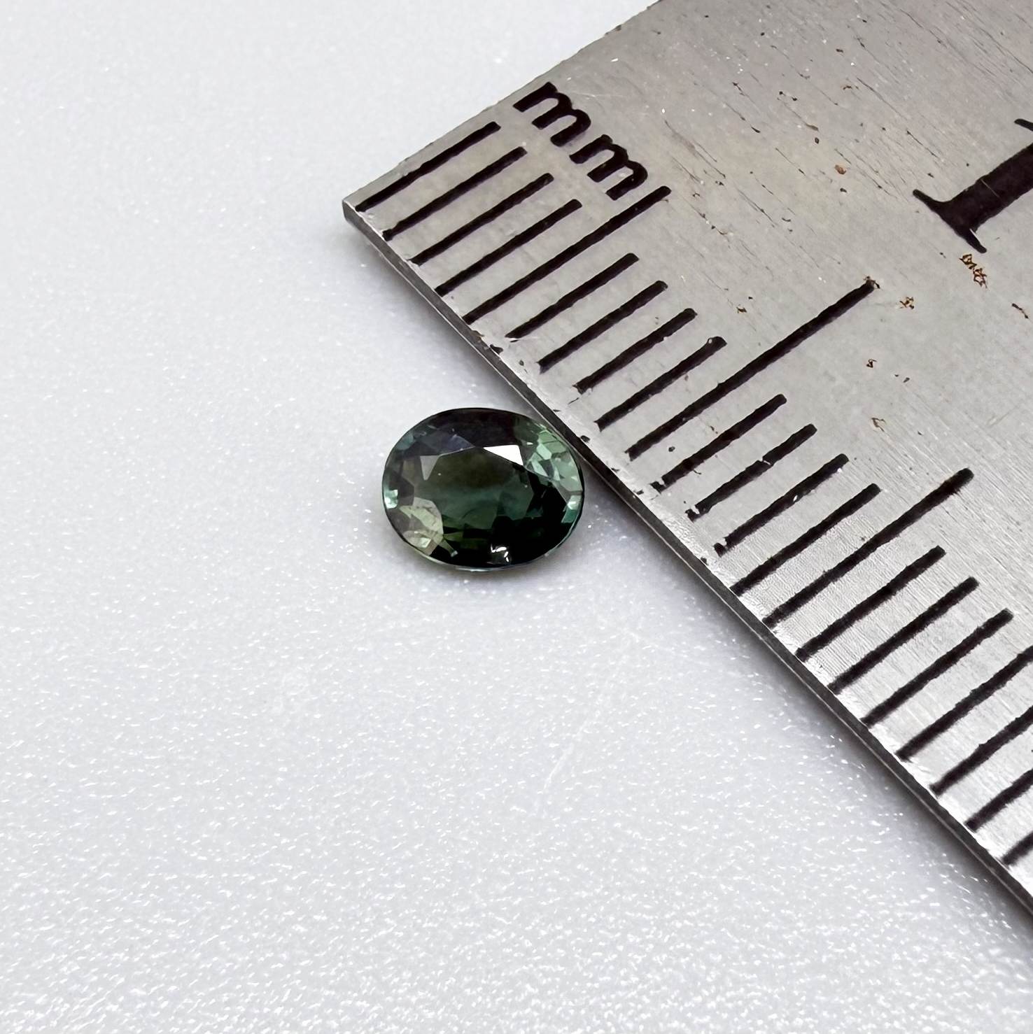 0.30 ct natural teal Laos sapphire with oval faceted cut and vibrant teal colour