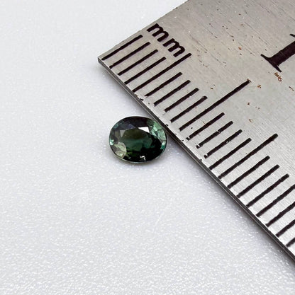 0.30 ct natural teal Laos sapphire with oval faceted cut and vibrant teal colour