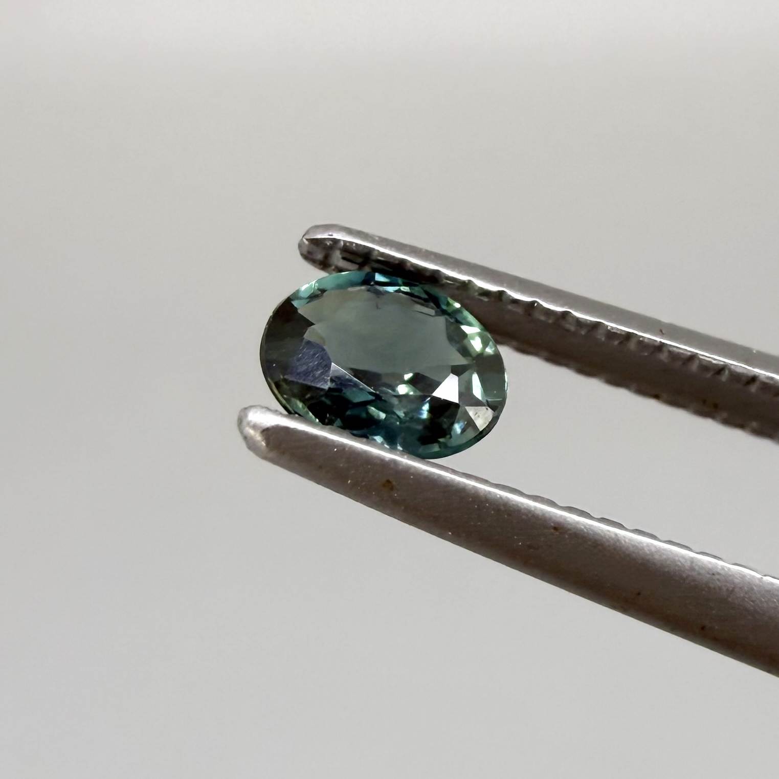 0.30 ct natural teal Laos sapphire with oval faceted cut and vibrant teal colour