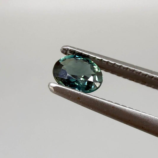 0.30 ct natural teal Laos sapphire with oval faceted cut and vibrant teal colour