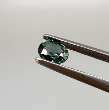 0.30 ct natural teal Laos sapphire with oval faceted cut and vibrant teal colour