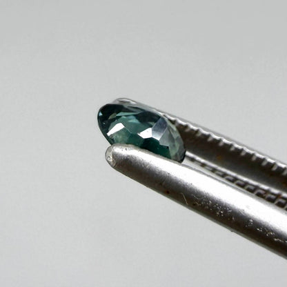 0.30 ct natural teal Laos sapphire with oval faceted cut and vibrant teal colour