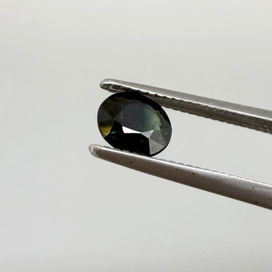0.34 ct natural deep teal Laos sapphire with oval faceted cut and rich teal colour