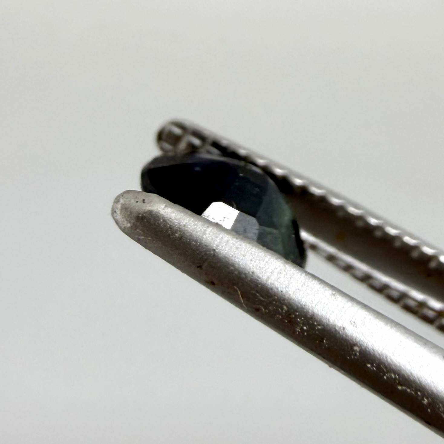 0.34 ct natural deep teal Laos sapphire with oval faceted cut and rich teal colour