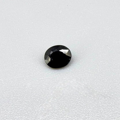 0.34 ct natural deep teal Laos sapphire with oval faceted cut and rich teal colour
