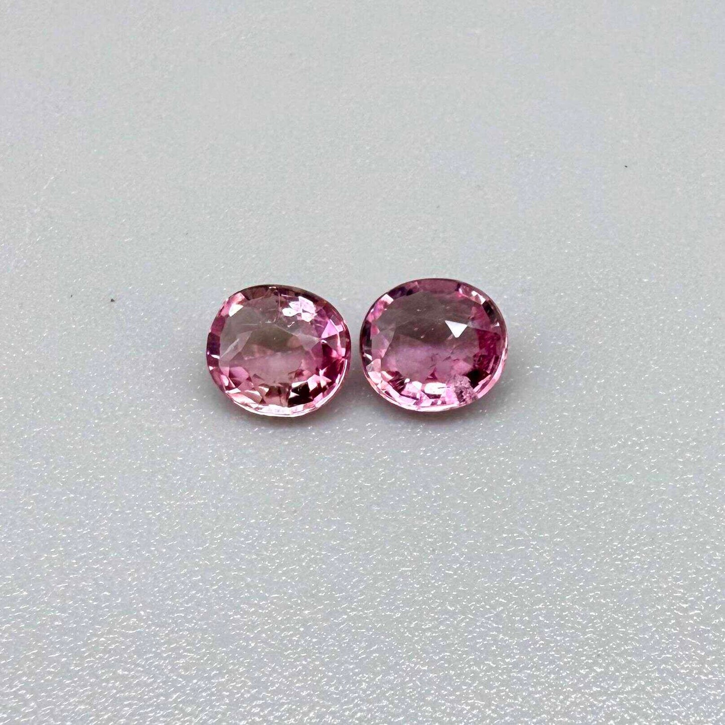 Natural untreated pink tourmaline matching pair, 0.84 ct total weight, round cut gemstones from Nigeria with soft pink colour for custom earrings.