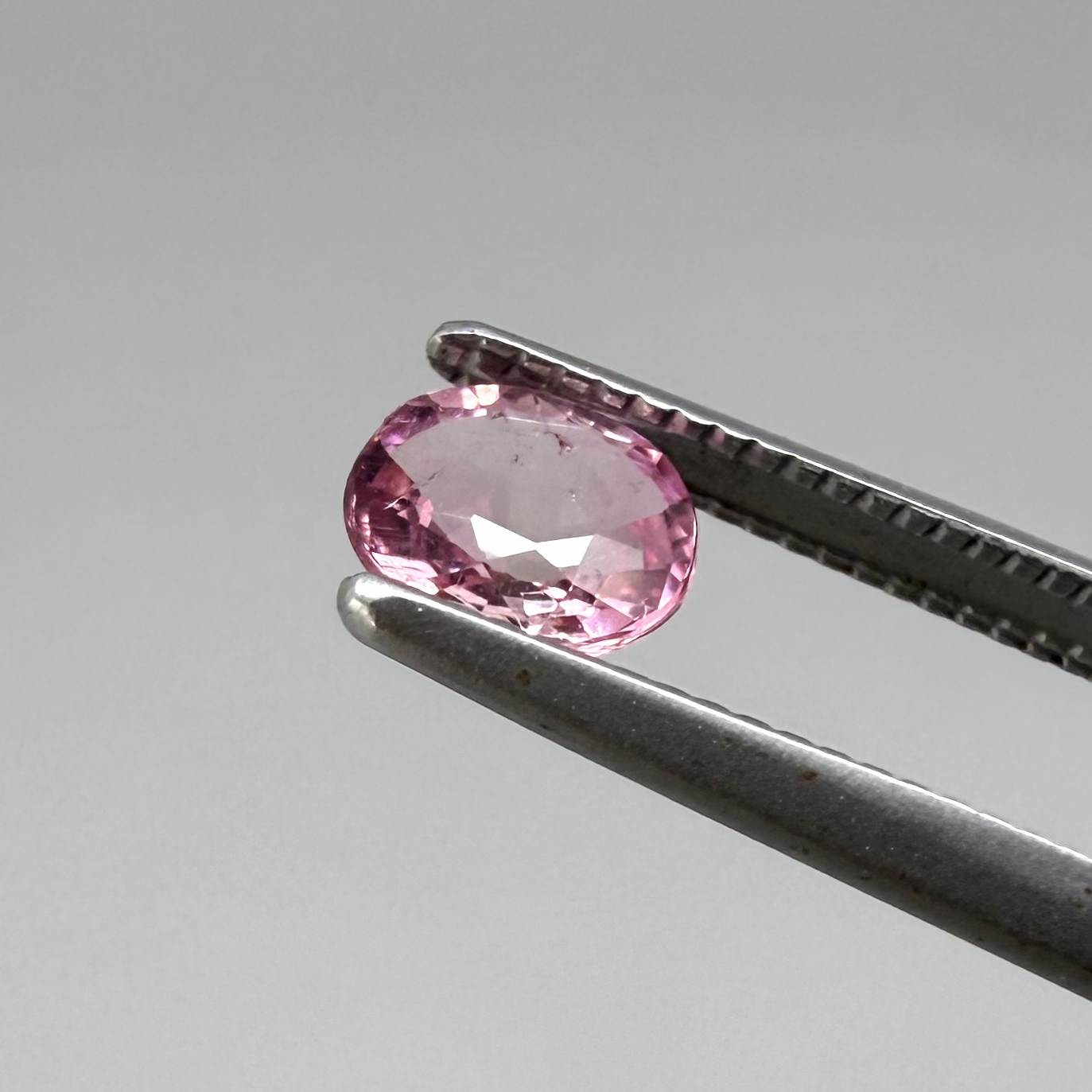 Natural untreated pink tourmaline matching pair, 0.84 ct total weight, round cut gemstones from Nigeria with soft pink colour for custom earrings.