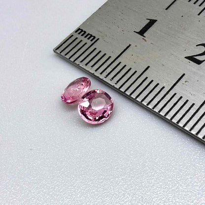 Natural untreated pink tourmaline matching pair, 0.84 ct total weight, round cut gemstones from Nigeria with soft pink colour for custom earrings.