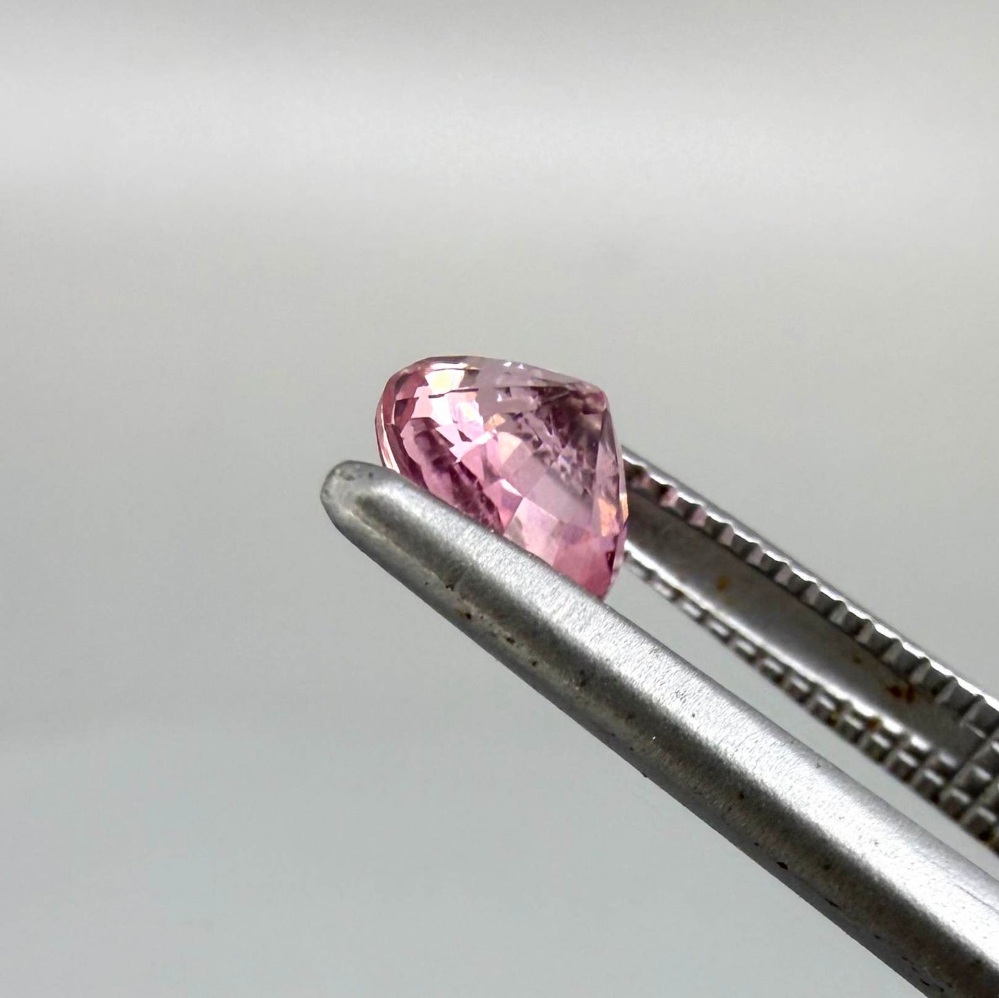 Natural untreated pink tourmaline, 0.57 ct round cut from Nigeria, eye-clean with bright pink colour and excellent brilliance.