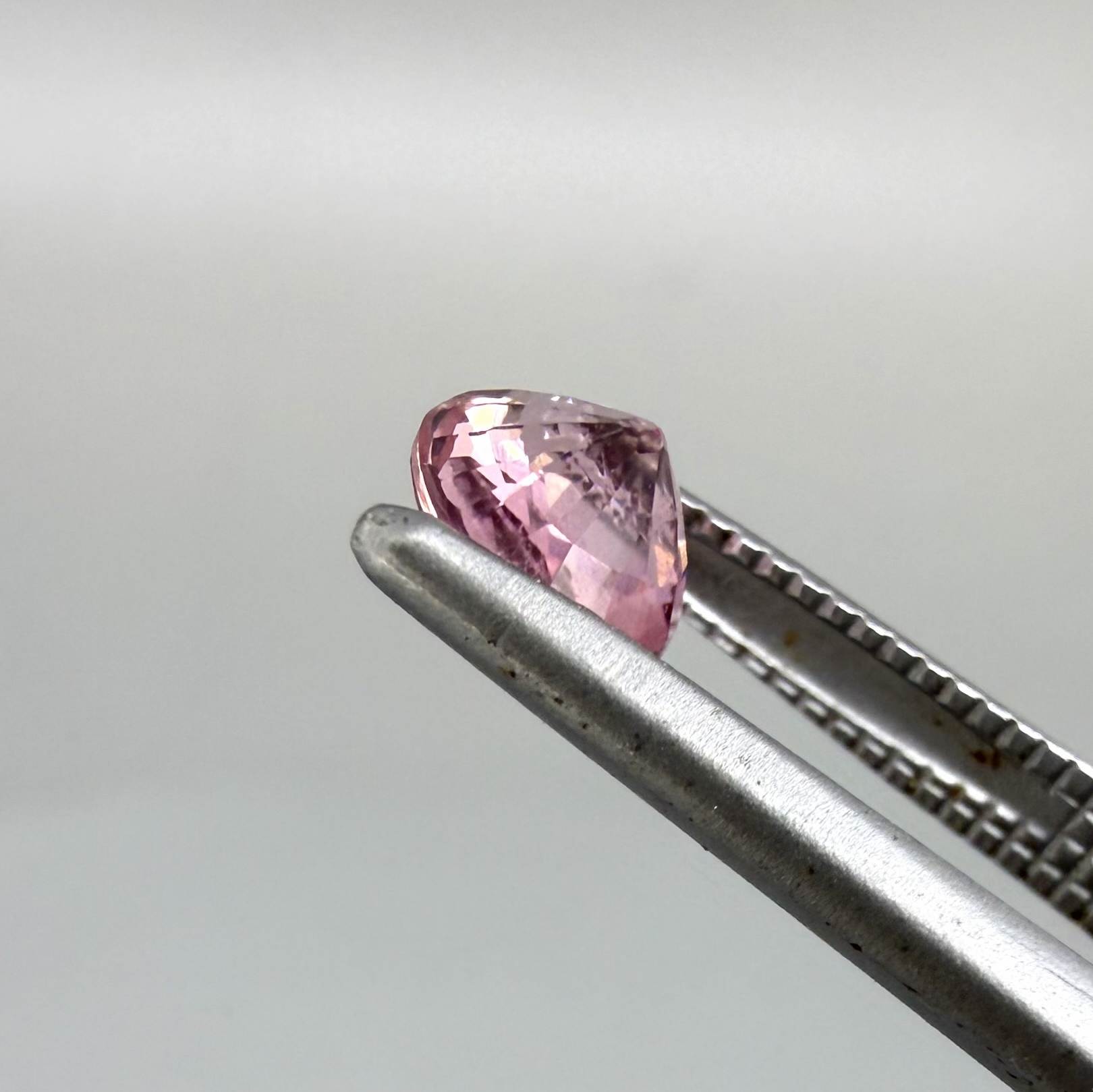 Natural untreated pink tourmaline, 0.57 ct round cut from Nigeria, eye-clean with bright pink colour and excellent brilliance.