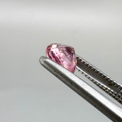 Natural untreated pink tourmaline, 0.57 ct round cut from Nigeria, eye-clean with bright pink colour and excellent brilliance.