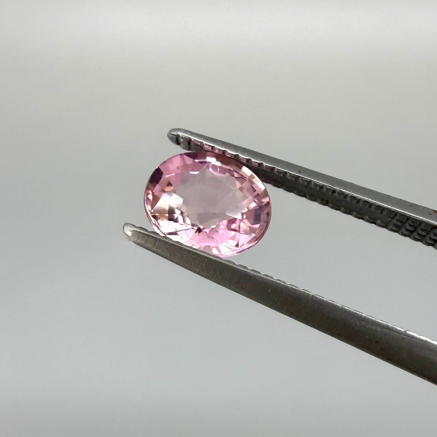 Natural untreated pink tourmaline, 0.72 ct oval cut from Nigeria with bright pink colour, eye-clean clarity and excellent brilliance.