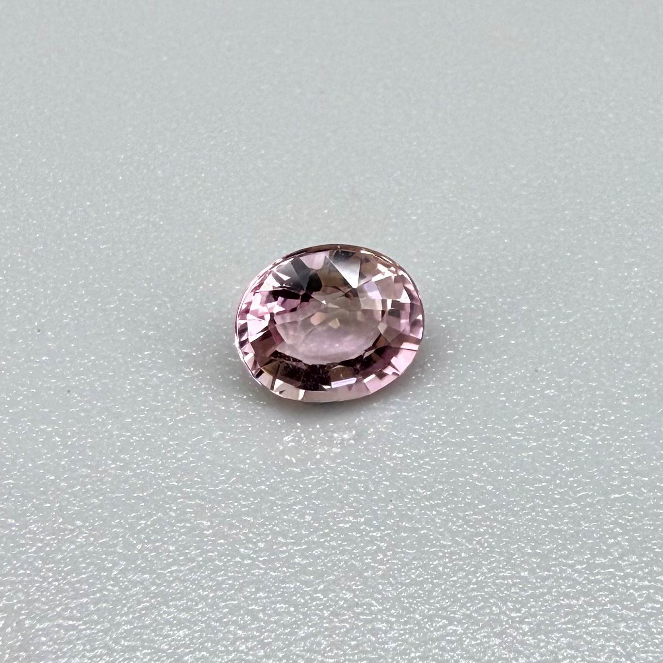 Natural untreated pink tourmaline, 0.72 ct oval cut from Nigeria with bright pink colour, eye-clean clarity and excellent brilliance.