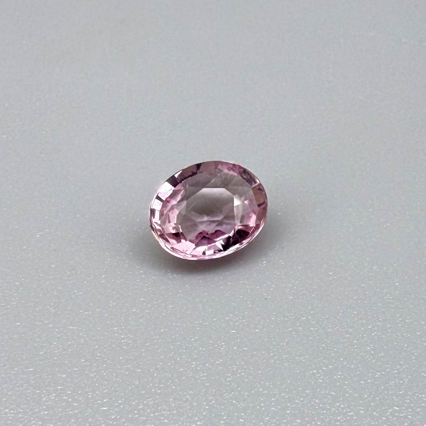 Natural untreated pink tourmaline, 0.95 ct oval cut from Nigeria with bright pink colour, eye-clean clarity and excellent brilliance.