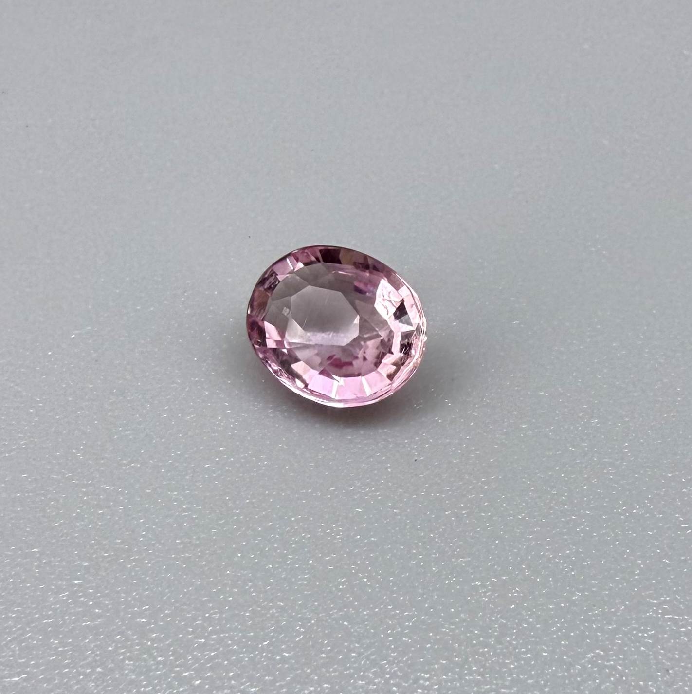 Natural untreated pink tourmaline, 0.95 ct oval cut from Nigeria with bright pink colour, eye-clean clarity and excellent brilliance.