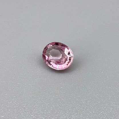 Natural untreated pink tourmaline, 0.95 ct oval cut from Nigeria with bright pink colour, eye-clean clarity and excellent brilliance.