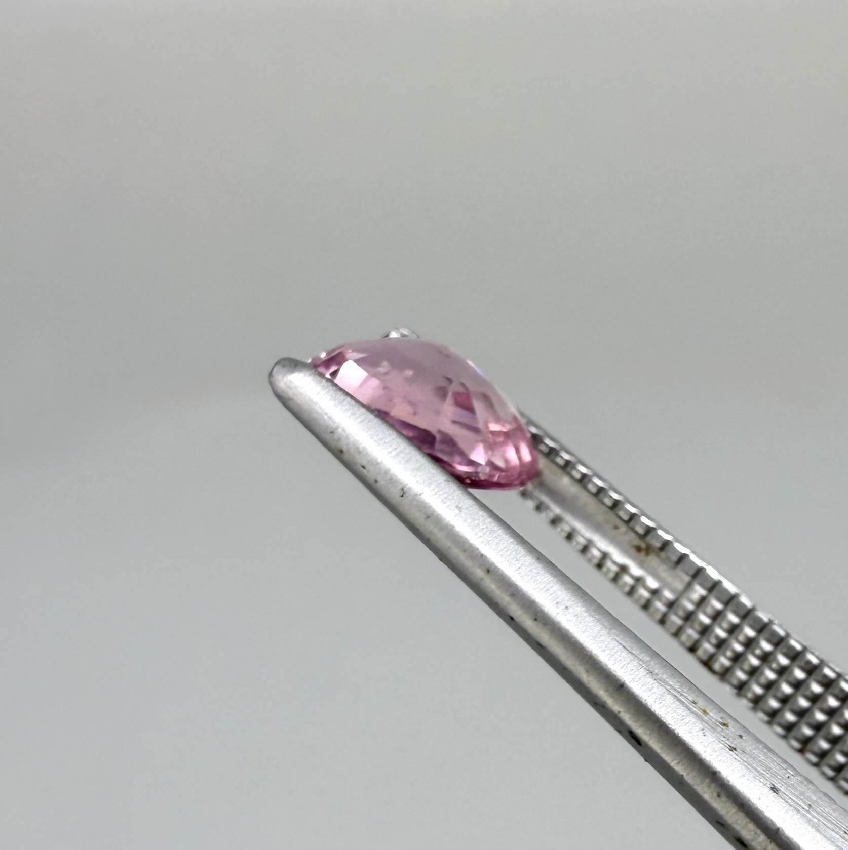 Natural untreated pink tourmaline, 0.95 ct oval cut from Nigeria with bright pink colour, eye-clean clarity and excellent brilliance.
