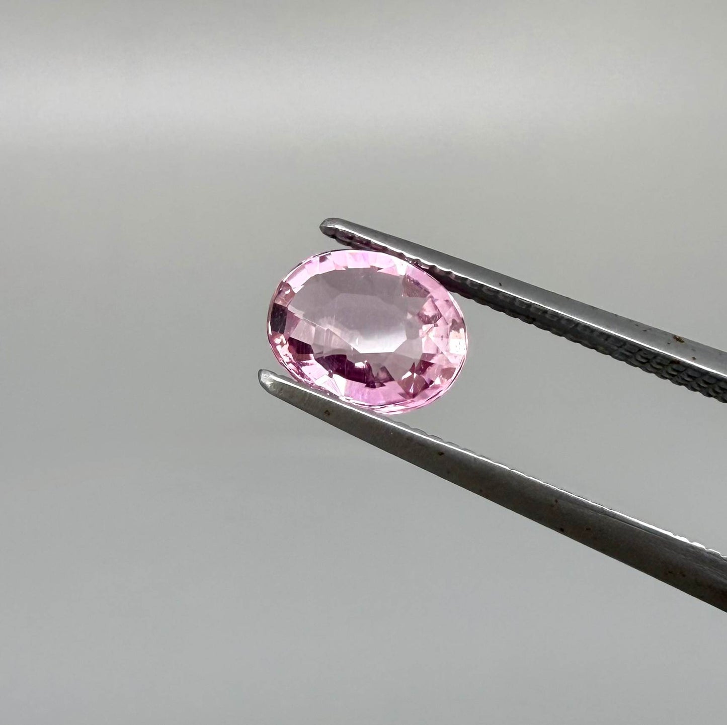 Natural untreated pink tourmaline, 0.95 ct oval cut from Nigeria with bright pink colour, eye-clean clarity and excellent brilliance.