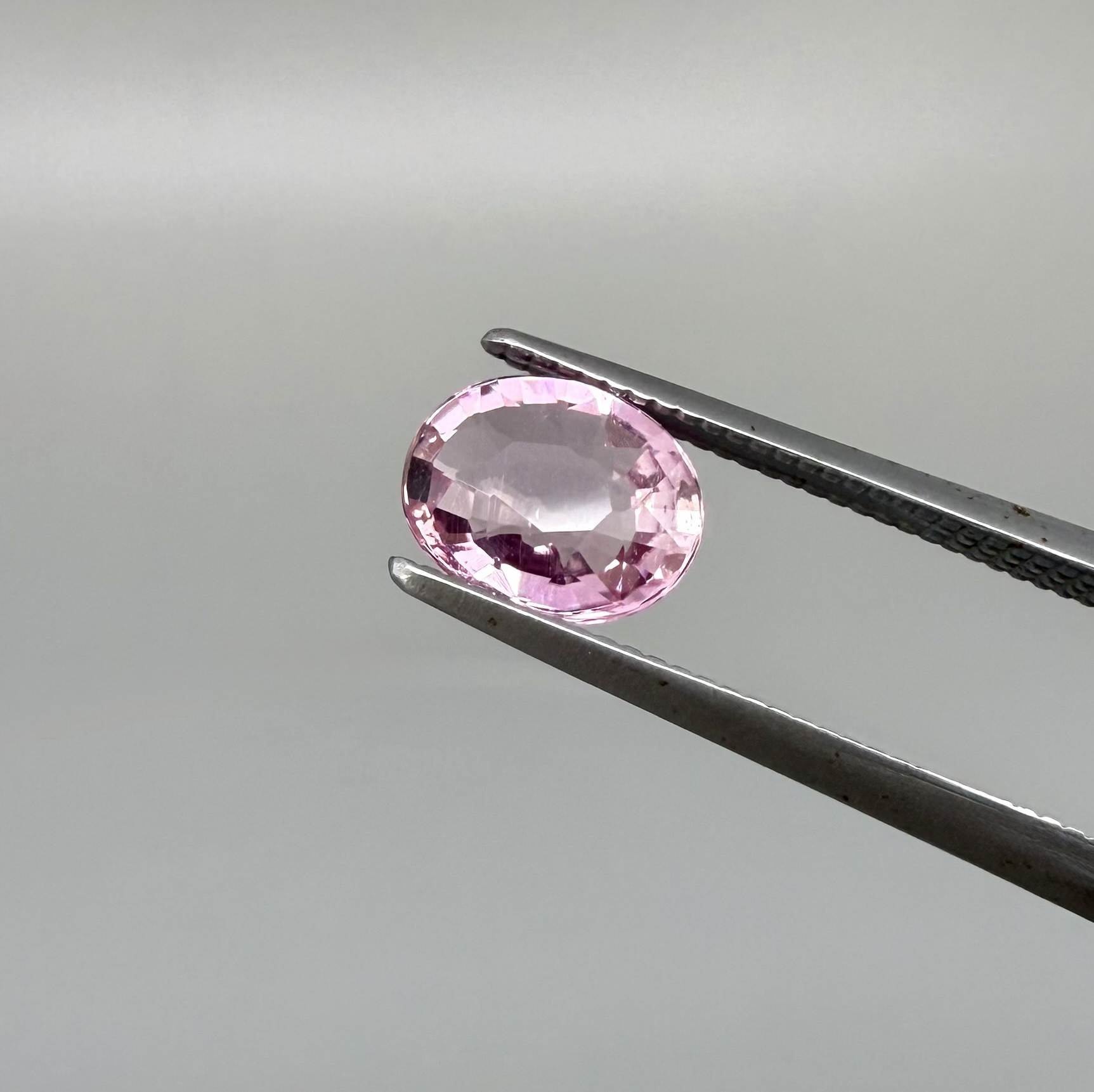 Natural untreated pink tourmaline, 0.95 ct oval cut from Nigeria with bright pink colour, eye-clean clarity and excellent brilliance.