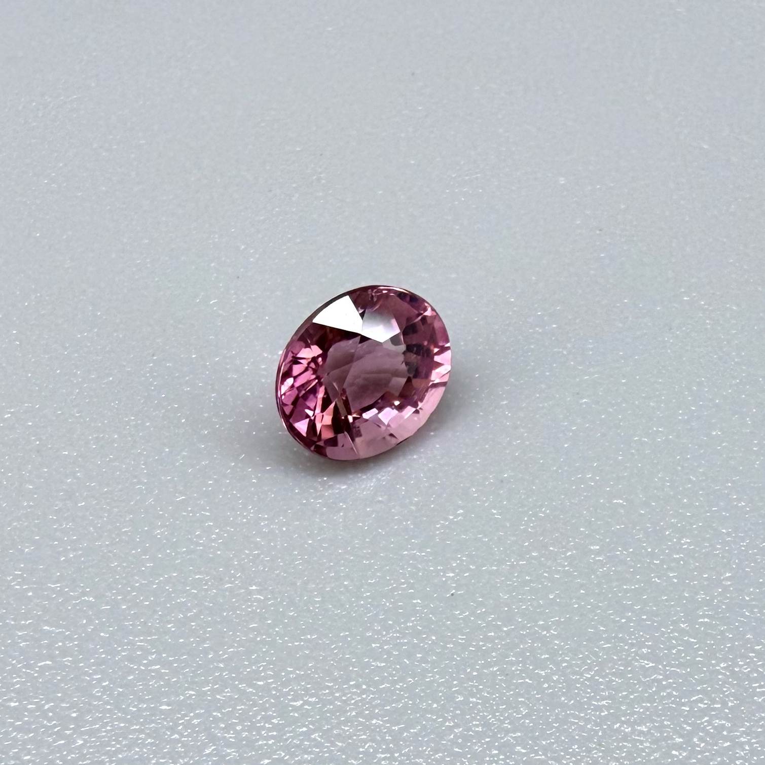 Natural untreated pink tourmaline, 0.56 ct oval cut from Nigeria with vivid pink colour, eye-clean clarity and excellent brilliance.