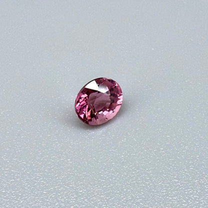 Natural untreated pink tourmaline, 0.56 ct oval cut from Nigeria with vivid pink colour, eye-clean clarity and excellent brilliance.