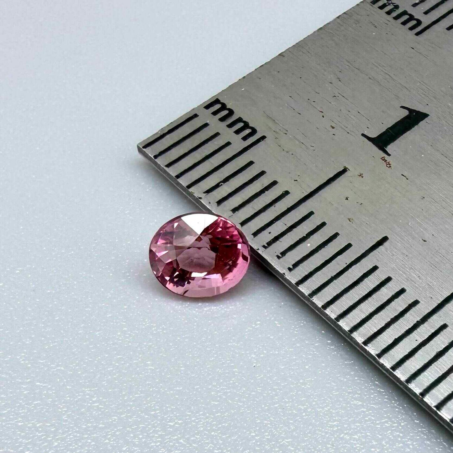 Natural untreated pink tourmaline, 0.56 ct oval cut from Nigeria with vivid pink colour, eye-clean clarity and excellent brilliance.
