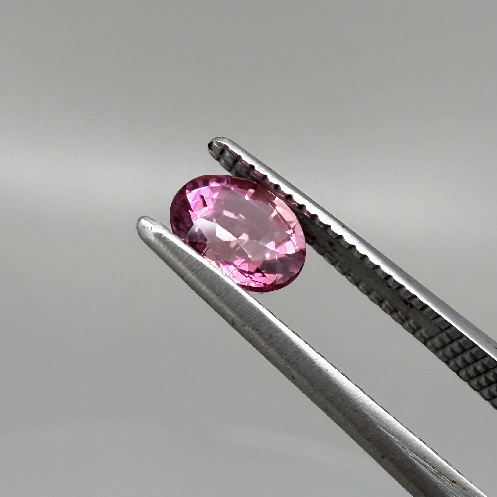 Natural untreated pink tourmaline, 0.56 ct oval cut from Nigeria with vivid pink colour, eye-clean clarity and excellent brilliance.