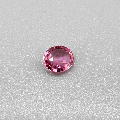 Natural untreated raspberry pink tourmaline, 0.41 ct round cut from Nigeria with vivid raspberry pink colour, eye-clean clarity and excellent brilliance.