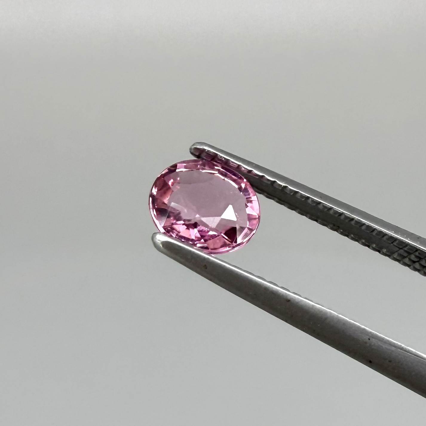 Natural untreated raspberry pink tourmaline, 0.41 ct round cut from Nigeria with vivid raspberry pink colour, eye-clean clarity and excellent brilliance.