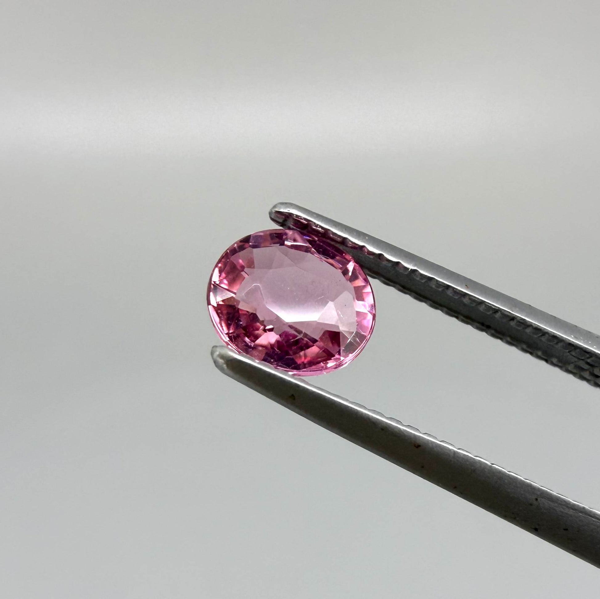 Natural untreated raspberry pink tourmaline, 0.41 ct round cut from Nigeria with vivid raspberry pink colour, eye-clean clarity and excellent brilliance.