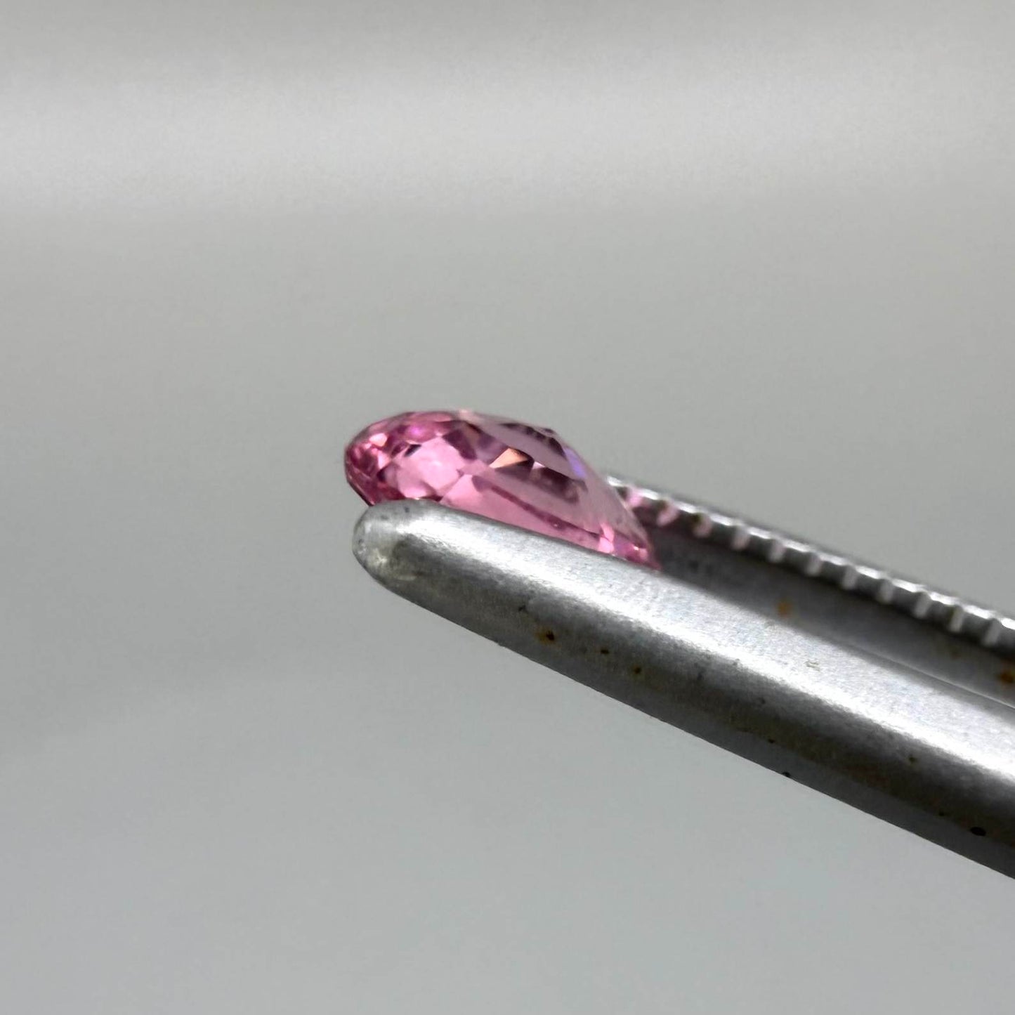 Natural untreated raspberry pink tourmaline, 0.41 ct round cut from Nigeria with vivid raspberry pink colour, eye-clean clarity and excellent brilliance.