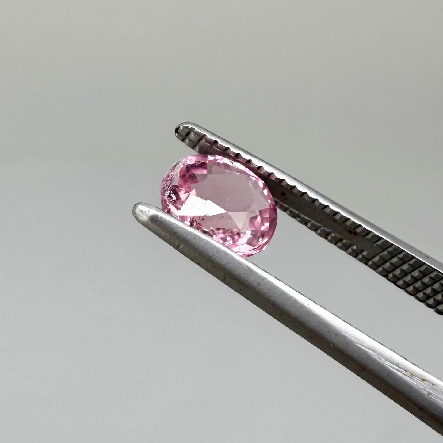 Natural untreated pink tourmaline, 0.67 ct oval cut from Nigeria with soft pink colour, eye-clean clarity and excellent brilliance.