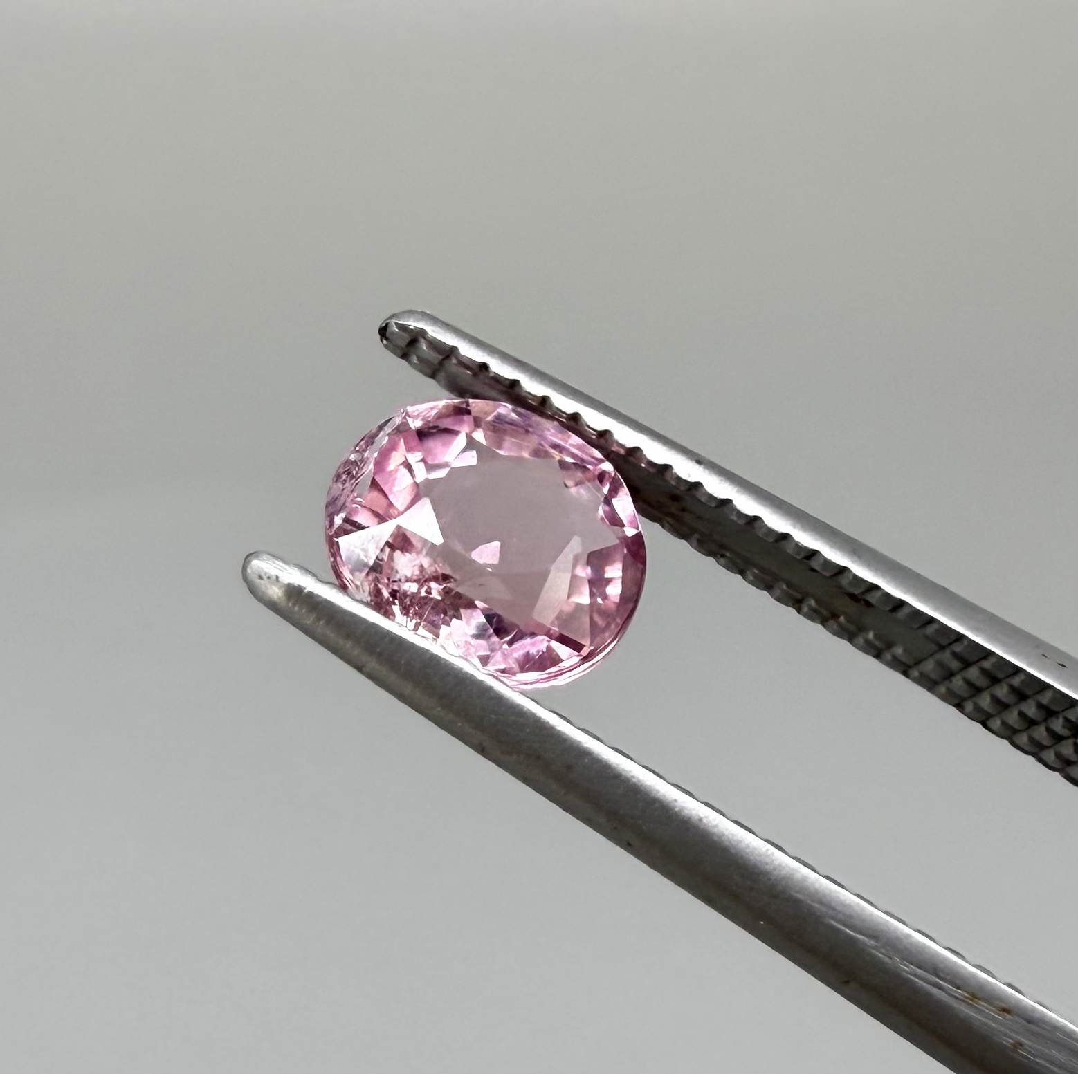 Natural untreated pink tourmaline, 0.67 ct oval cut from Nigeria with soft pink colour, eye-clean clarity and excellent brilliance.