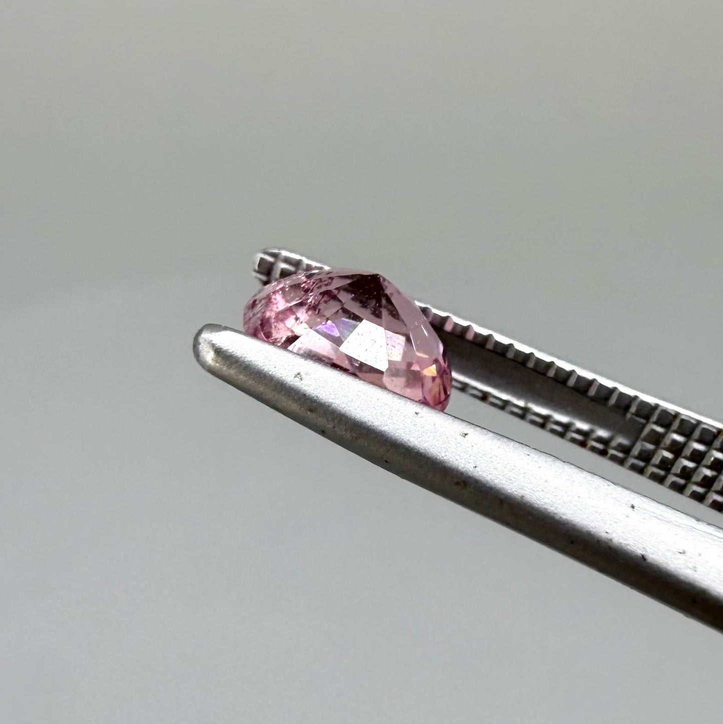 Natural untreated pink tourmaline, 0.67 ct oval cut from Nigeria with soft pink colour, eye-clean clarity and excellent brilliance.