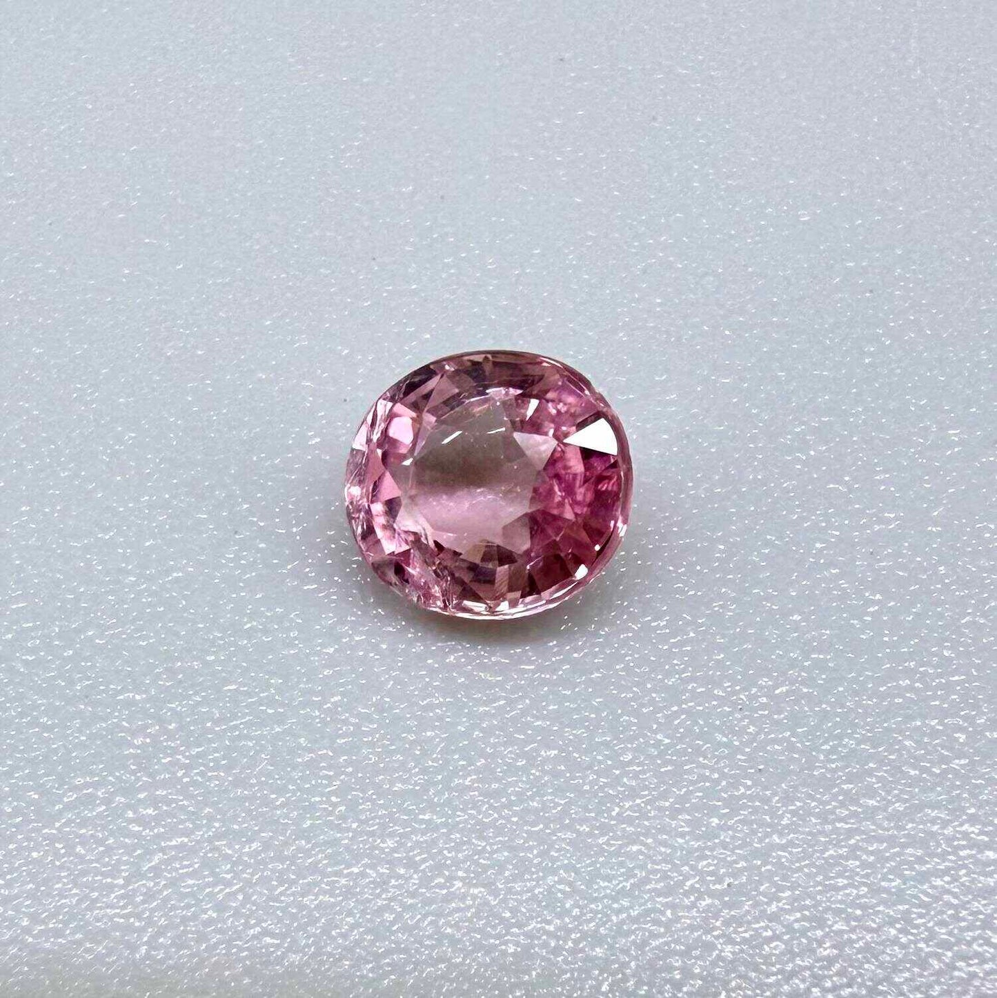 Natural untreated pink tourmaline, 0.67 ct oval cut from Nigeria with soft pink colour, eye-clean clarity and excellent brilliance.